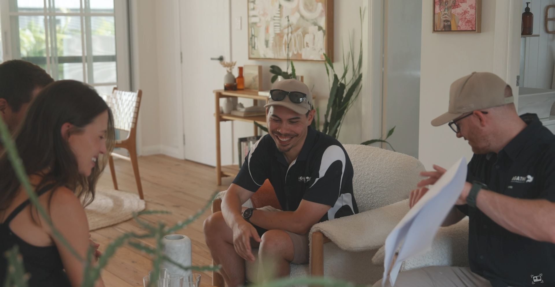 AGATHĒ team meeting with clients in a living room