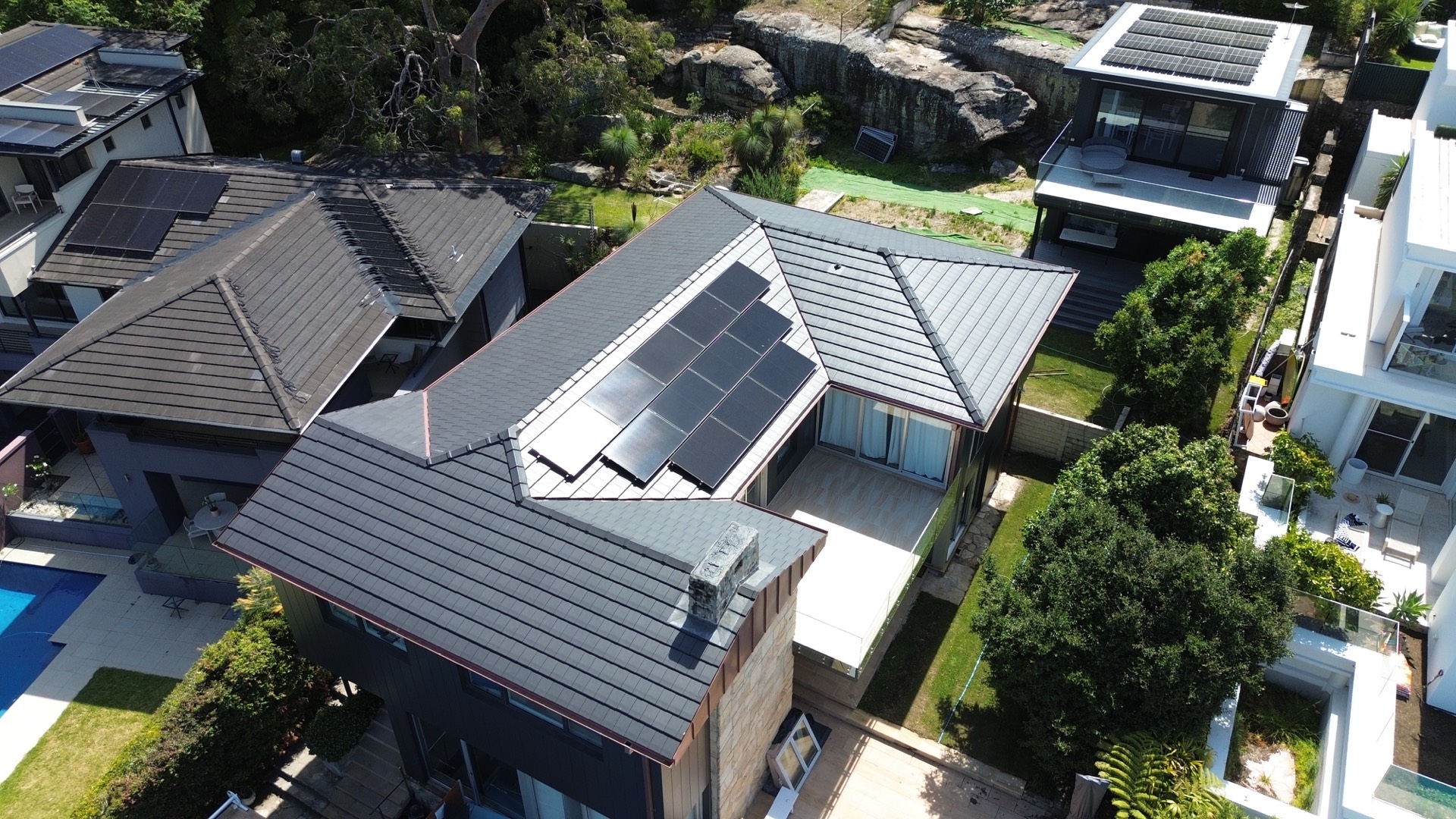 Aerial view of the Balgowlah Heights home showing the rebuilt terracotta tile roof with solar panels