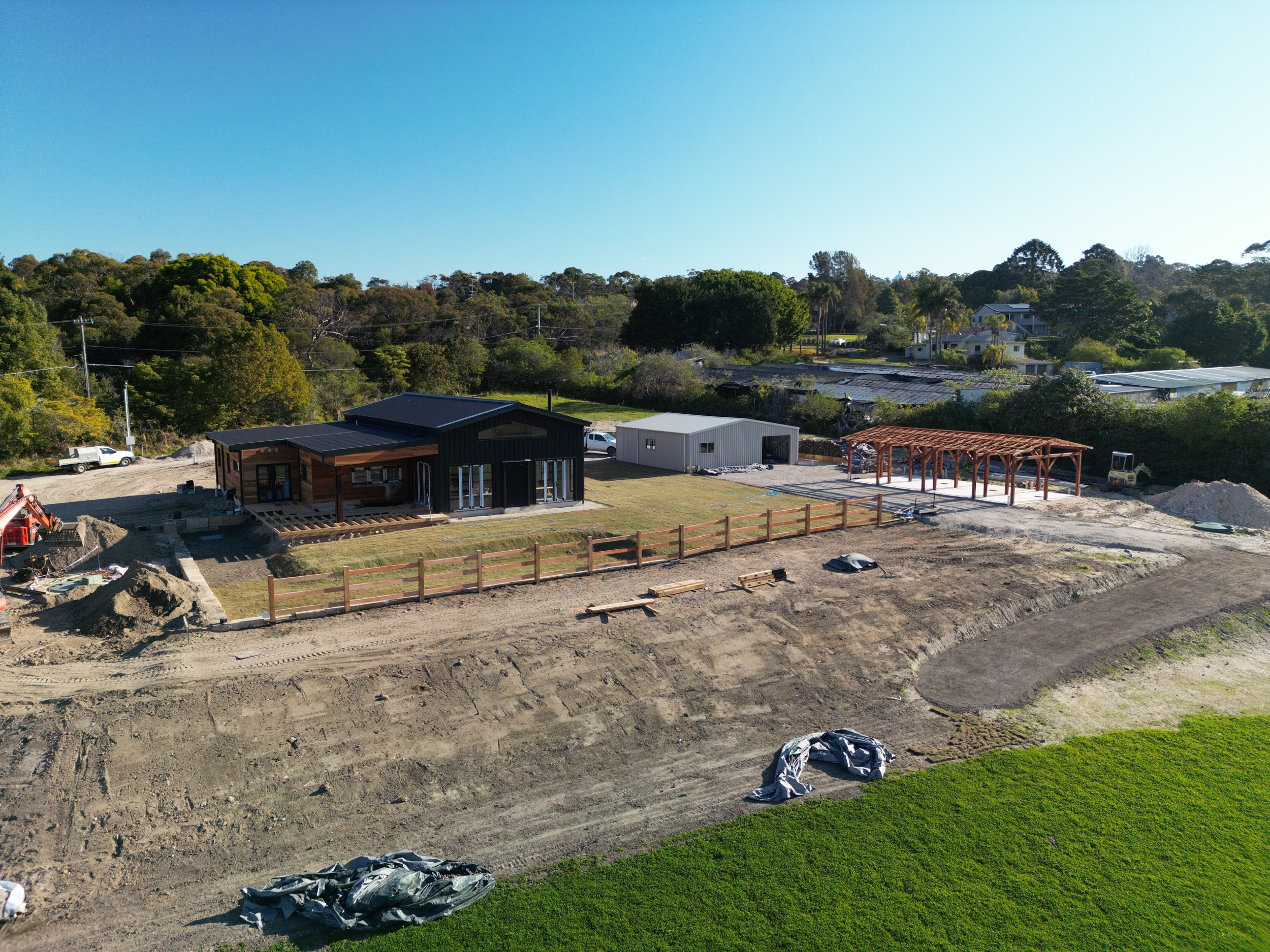 Aerial view of Ingleside custom new home on acreage, under construction, AGATHĒ Builders