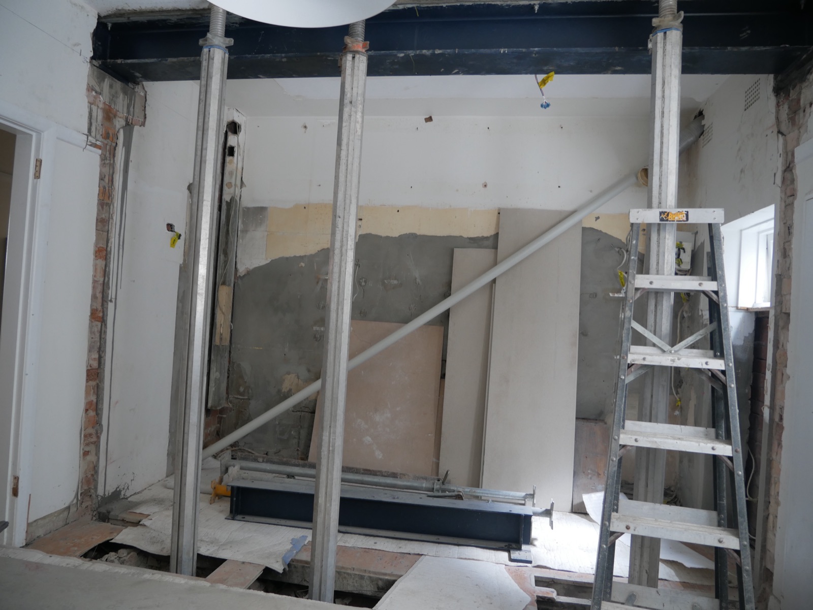 New structural steel beam supported by acrow props during the Neutral Bay apartment renovation
