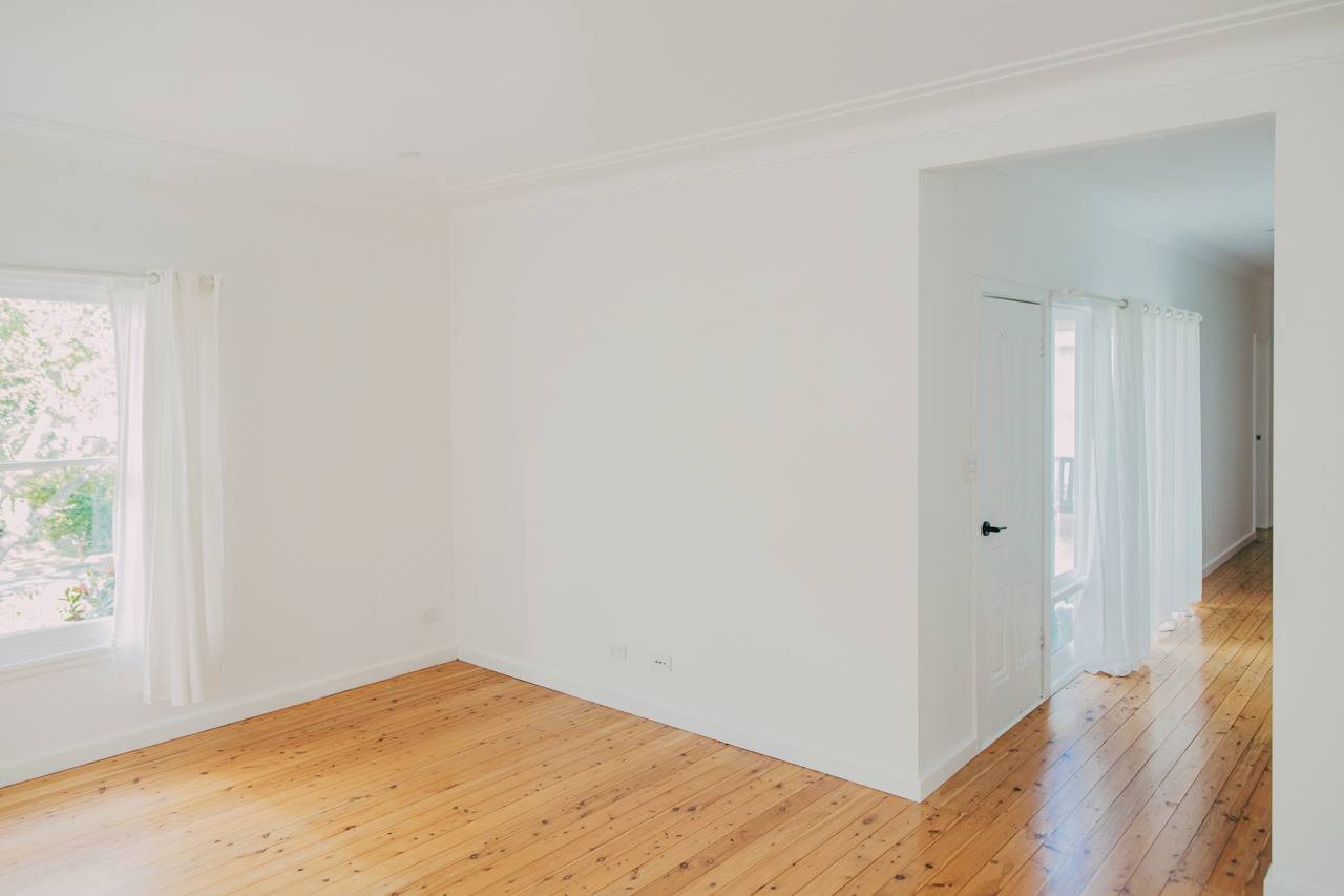 Light-filled interior living space with timber flooring in the renovated Pymble home