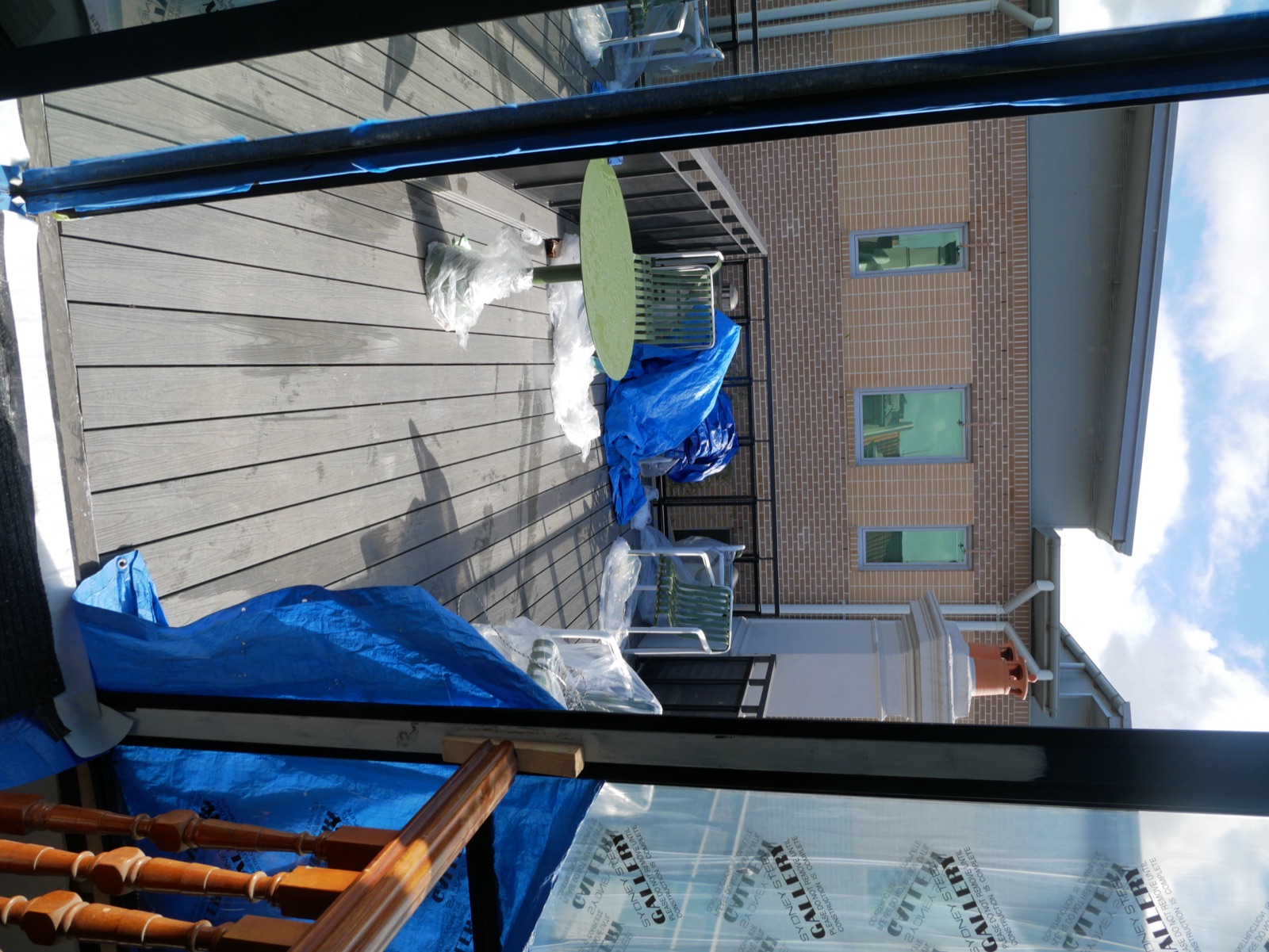 The rebuilt rooftop terrace of the Redfern terrace renovation, seen through the new steel-framed doors